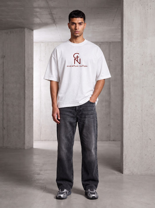 Christian Nation Banner T-Shirt in white, full-length outfit with grey jeans (image 2 of 2)